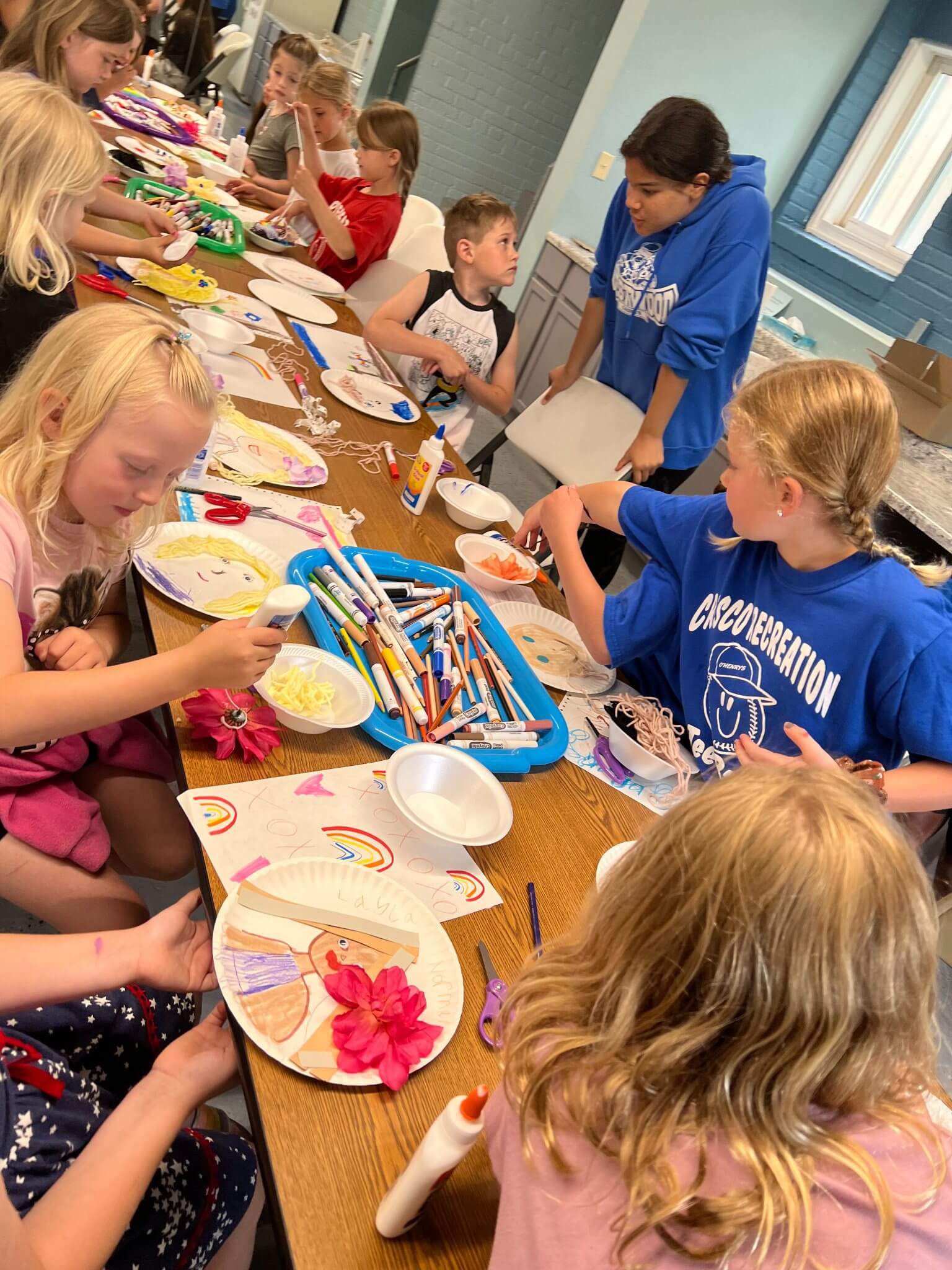 Kids doing arts and crafts in meeting room